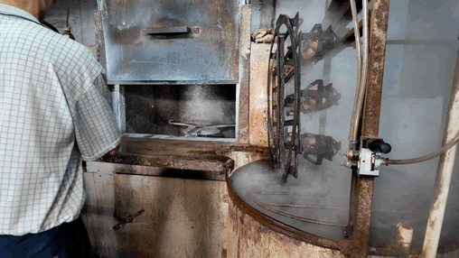 Pushing the molds into the oven for rotational heating