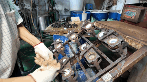 Removeing the vinyl toy components from the cooled mold