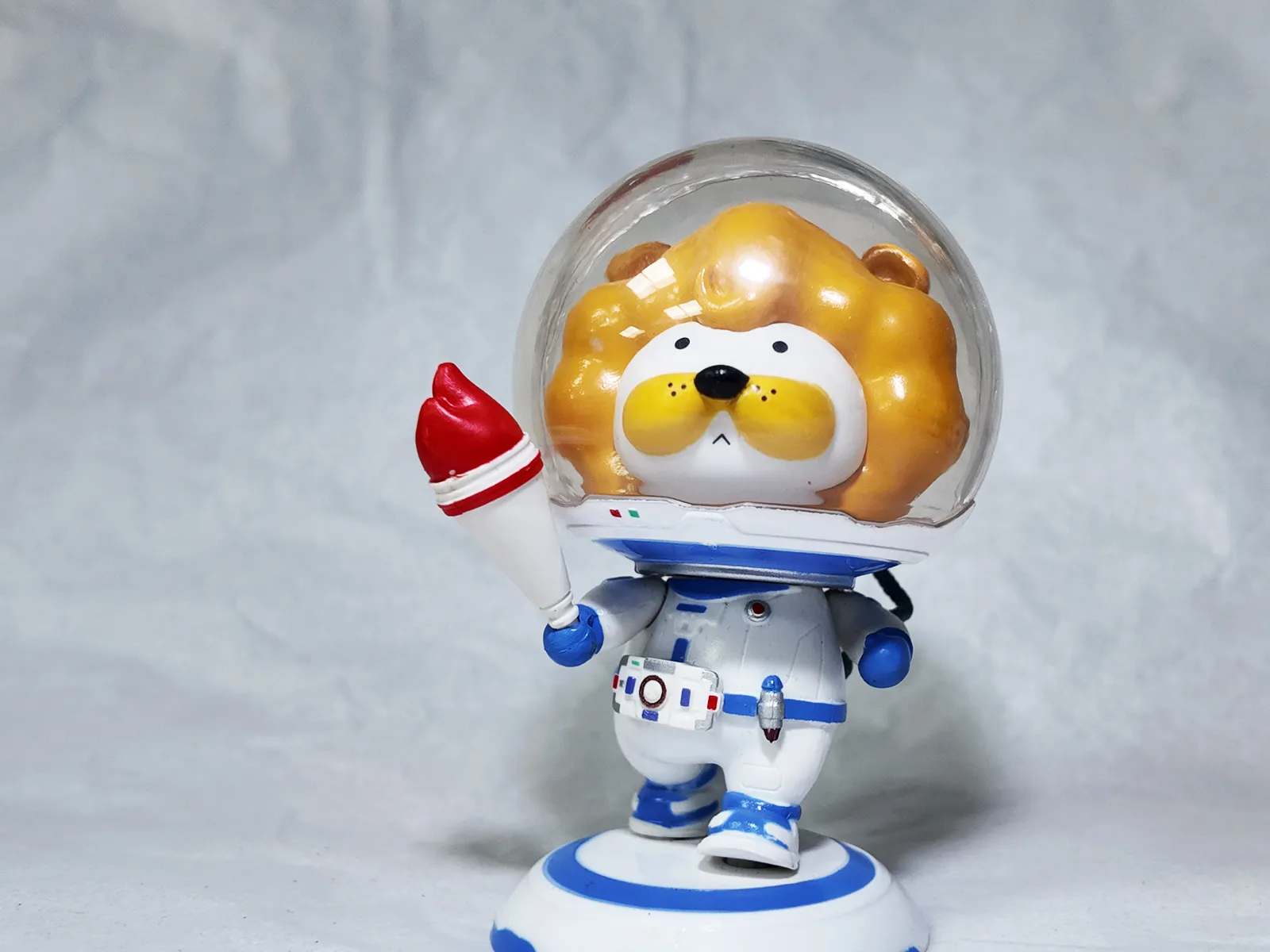 Cute space torch lion athlete PVC figure.