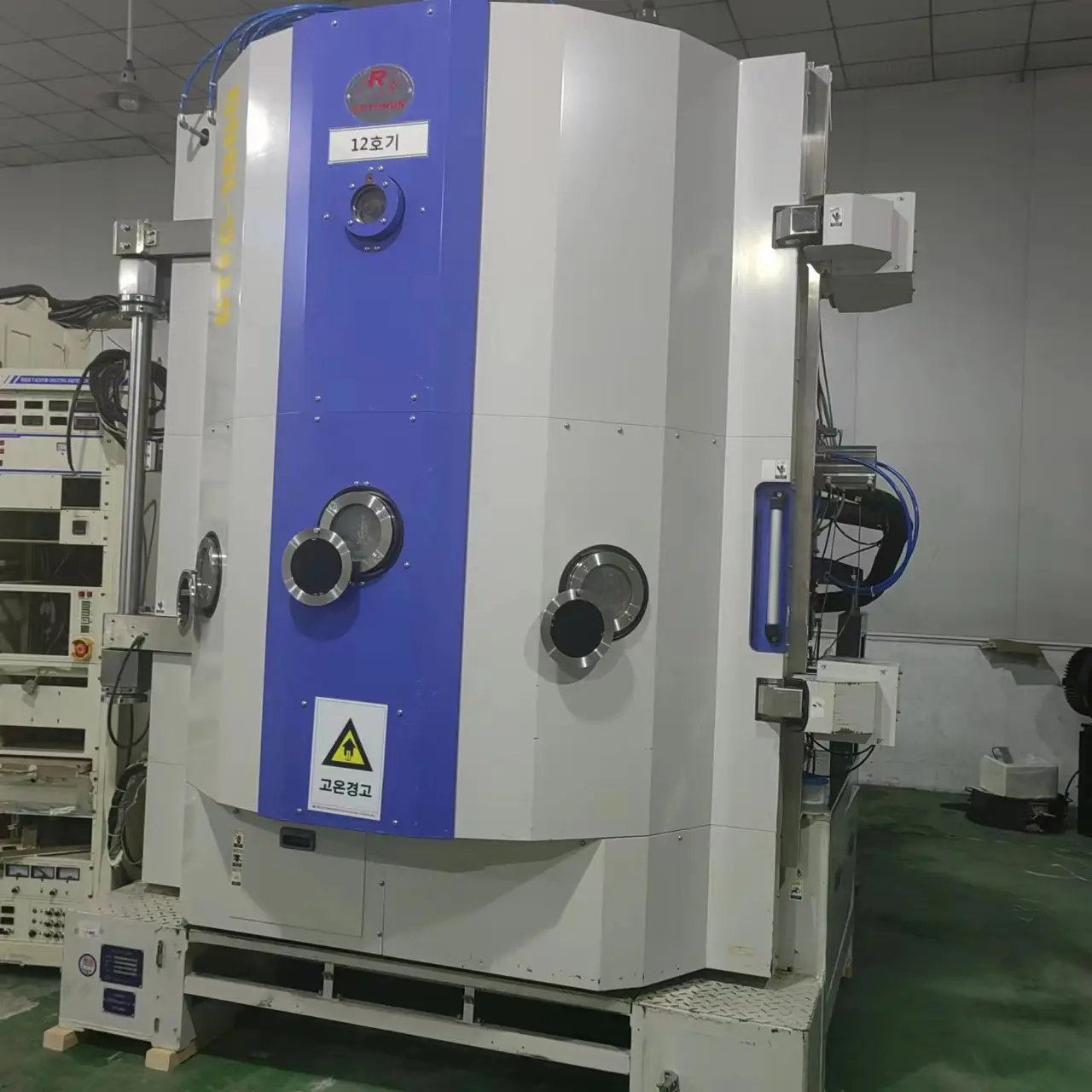 Vacuum metallizing equipment for applying metallic reflective finish to toys