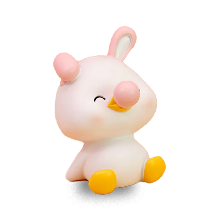 A white duck piggy bank blowing bubbles
